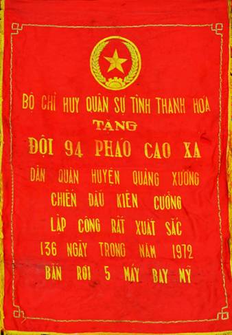 A red banner with gold text

Description automatically generated