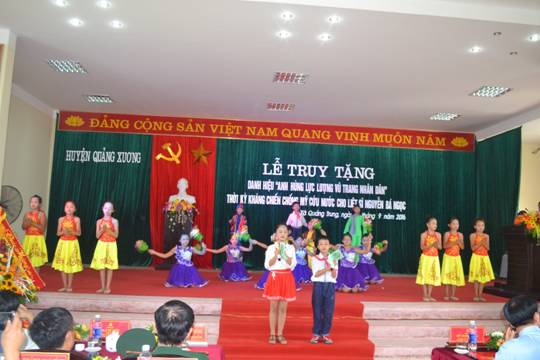 A group of children performing on a stage

Description automatically generated